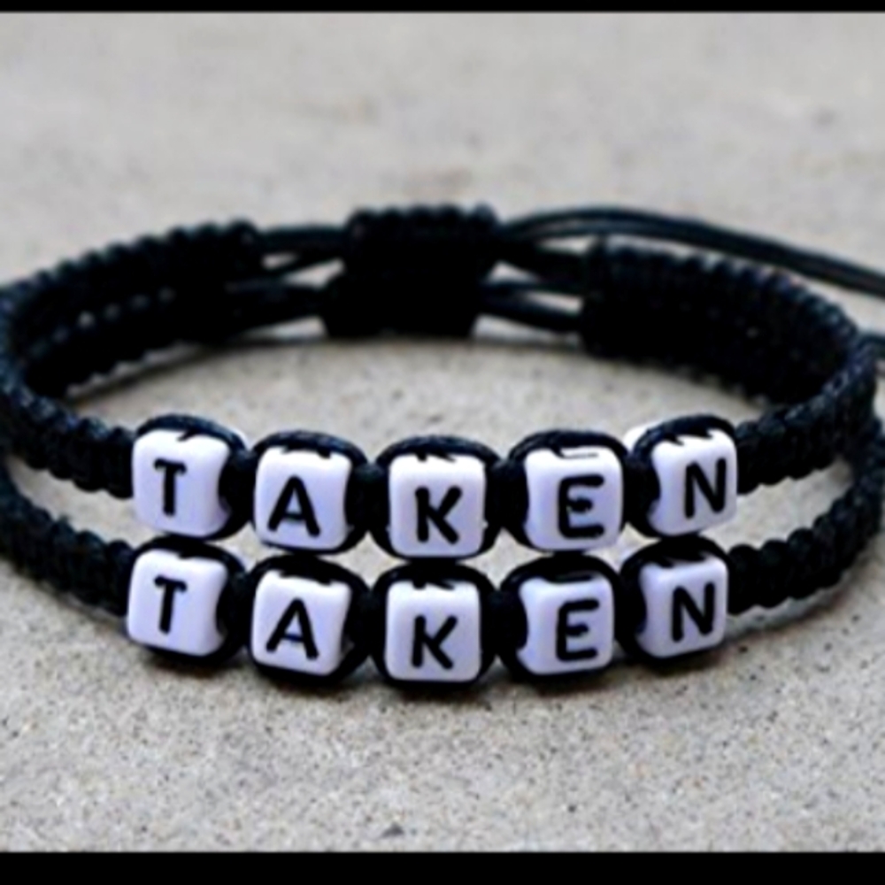 A pair of black bracelets taken
